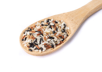 Raw assorted rice in a spoon isolated over white background
