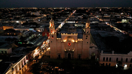 Aerial camera at night showing the front of the Cathedral of Merida, Yucatan, Mexico. - obrazy, fototapety, plakaty
