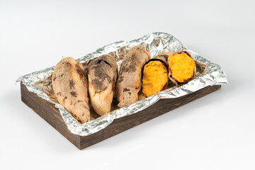 Fresh roasted sweet potatoes on a pure white background