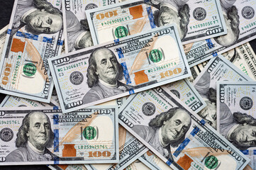us dollars background, dollar banknotes in random order, 100 dollar bills, flat lay