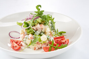 russian salad on the white plate