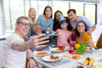 surprise granddaughter with chocolate cake for birthday party with group of happy and smile family at home after dinner meal with many food for celebration