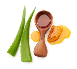 Honeycomb with aloe vera leaves on white background
