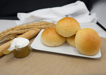 Fresh fragrant bread and bun on the table with copy space. Food concept