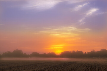 Fototapeta na wymiar A misty sunrise over Briston