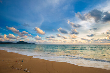 Idyllic sunset sky with cloud on sea beach sand wave