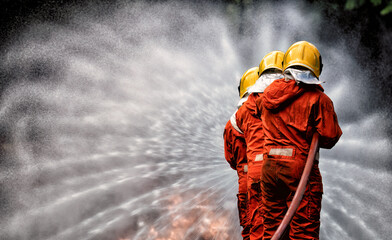 In Industry safety fire fighter team department on  training fight with gas and oil fire by hold...