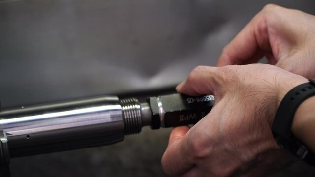 Inspection of industrial threaded plug gauge workpieces industrial concept