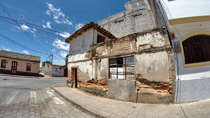Fototapeta na wymiar Derelict building on a corner in Cotacachi, Ecuador, taken with a fisheye lens