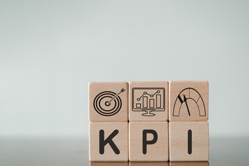 KPI (KEY, Performance and Indicator) for banner,presentation,wallpaper,background,business concept.,Wooden Cube with KPI and symbols.,copyspace.