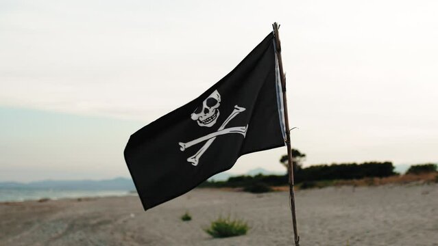 Pirates flag weaving on the beach 