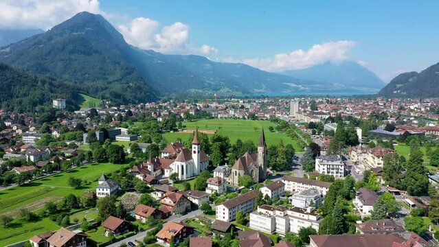 Aerial view over the city of Interlaken in Switzerland. Beautiful view of Interlaken town, Eiger, Monch and Jungfrau mountains and of Lake Thun and Brienz. Interlaken, Bernese Oberland, Switzerland.