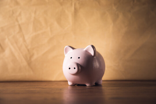 Piggy Bank On Vintage Background