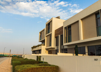 Dubai, UAE - 08.16.2022 - Close up shot of a facade of a modern townhouse in Dubai South district....