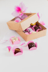 Candies on white background. Spring feminine composition. Food styling.