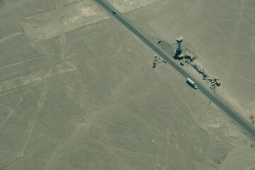 Beautiful shot of cars in Nazca Condor Lines Geoglyphs in the Nasca desert