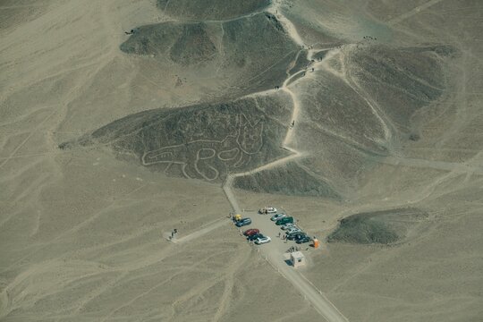 Beautiful shot of cars in Nazca Condor Lines Geoglyphs in the Nasca desert