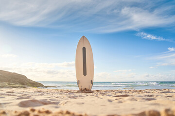 Surfboard for surfing staying on beach sand