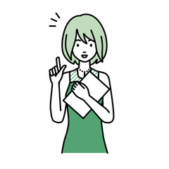 デスクで座ってPCを開いて何かひらめいたドレスの女性