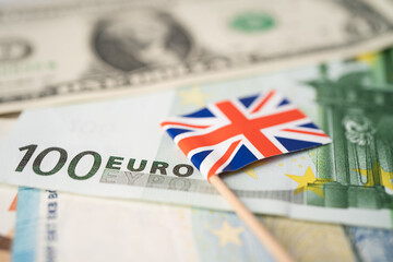 United Kingdom flag on Euro banknotes, finance and accounting, banking concept.