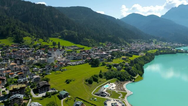 Auronzo Mountain Lake Aerial Footage with Green Forest and Blue Turquiose Water in the Dolomites Italy. 4K Aerial Video of a Landscape with Mountain Lake and Forest.
