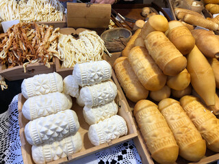 Traditional hand rolled cheeses with geometric designs 