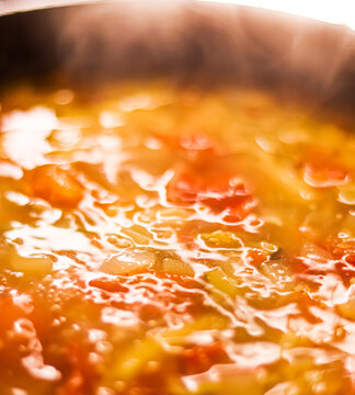 Cooking vegetable soup in saucepan, comfort food and homemade meal concept