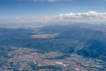 Aterno river valley near L'Aquila and Ovindoli upland, aerial, Italy
