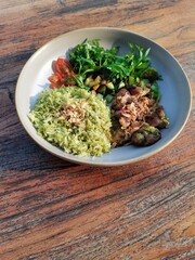 Sauted Beef with Green Basmati Rice and Cosmos leaf, tomatoes and chilly in the afternoon sunset light