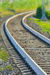 Obraz na płótnie Canvas perspective view of railroad tracks narrow focus field on foreground