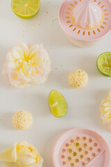 White chocolate candies and lemon slices on white background. Food Styling. Spring and Summer comfort food.