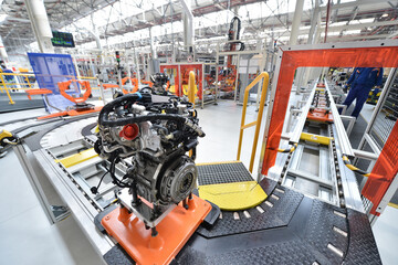 Auto engines factory with engines on the production line ready for assembly on car.