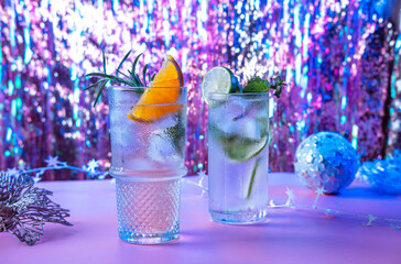 Two vibrant and sparkling alcoholic punch is perfect for Christmas party. Colorful cocktails in glasses.  Fresh holiday drinks.