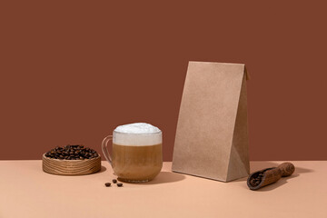 Coffee identity branding mockup. Blank brown craft bag with coffee beans and cup of coffee. Package mockup template for logo, brand, sticker, label.