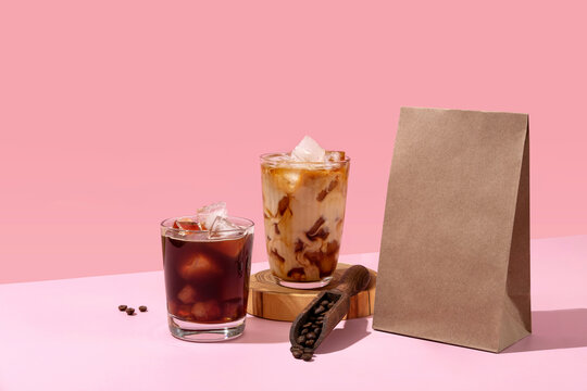 Coffee identity branding mockup. Blank brown craft bag with coffee beans and cup of coffee. Package mockup template for logo, brand, sticker, label.