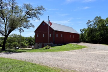 Fototapeta na wymiar The red abandoned barn in the countryside.