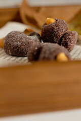 Cashew shape candy on white background. Food Styling concept.