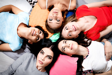 Circle of beautiful young women friends.