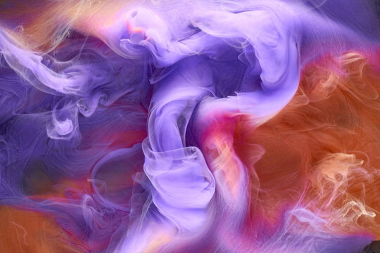 Multicolored orange lilac smoke abstract background, acrylic paint underwater explosion
