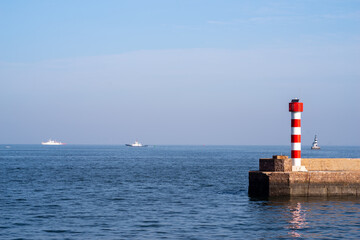 Little red and white striped lighthouse