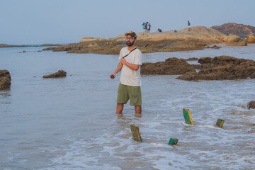 Travel photographer shooting beach with gopro