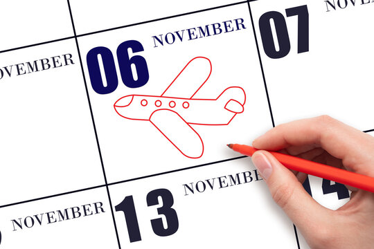 6th day of November. A hand drawing outline of airplane on calendar date 6 November. The date of flight on plane. Travel, business trips. Autumn month. Day of the year