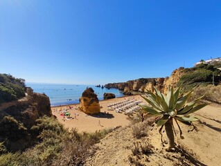 Praia Dona Ana beach with turquoise sea water and cliffs, Portugal. Beautiful Dona Ana Beach (Praia Dona Ana) in Lagos, Algarve, Portugal.
