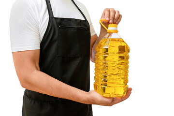 A bottle of sunflower oil in the hands of a cook on a white isolated background. The concept of...