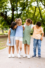 Group of asian and caucasian kids having fun in the park