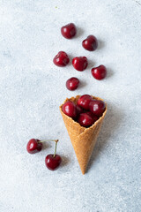 ripe red cherries in a waffle cup