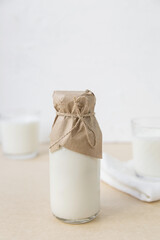 Ayran in a glass bottle on a light background