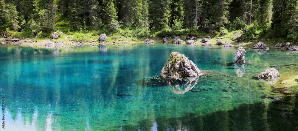 Poster beautiful view of the calm lake with reflection of trees in the water
