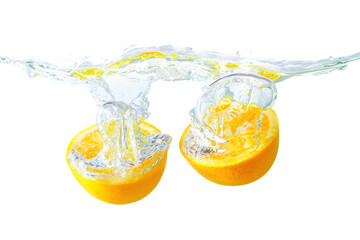 Fototapeta na wymiar Orange halves dropped in water with splashes