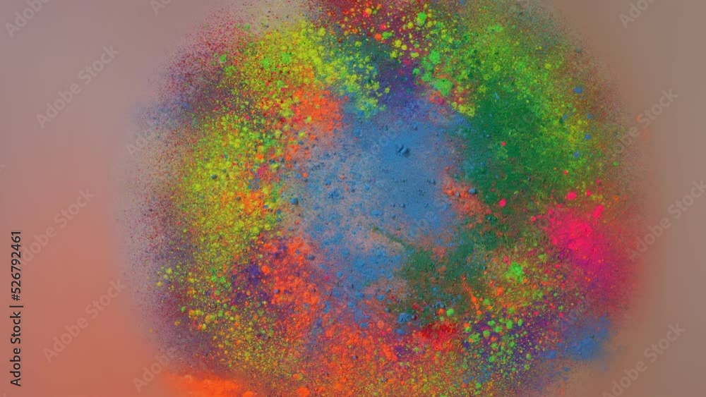 Poster sprinkle several colors of dust on the white paper that is spinning around until the dust is circula